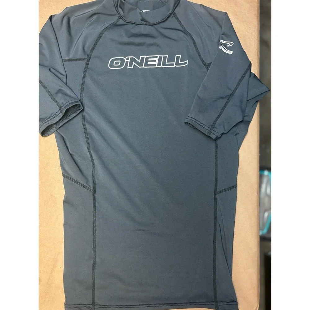 Boys size Medium gray O'Neill rash gaurd with white logo EU.  50+ ultraviolet pr